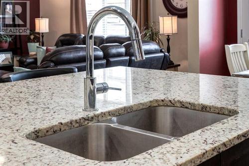 26 Mount Rae Terrace, Okotoks, AB - Indoor Photo Showing Kitchen With Double Sink With Upgraded Kitchen