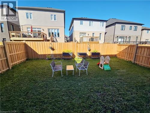 View of play area with a residential view and a fenced backyard - 293 Chokecherry Crescent, Waterloo, ON - Outdoor