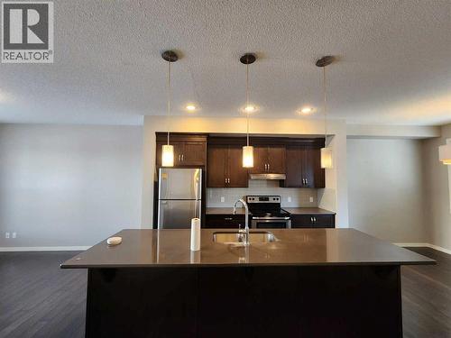 217 Panatella Walk Nw, Calgary, AB - Indoor Photo Showing Kitchen With Stainless Steel Kitchen With Double Sink
