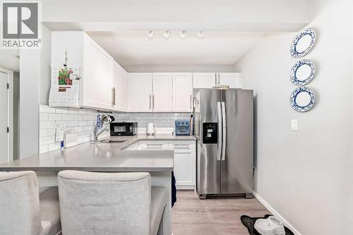 325 Sundown View, Cochrane, AB - Indoor Photo Showing Kitchen With Stainless Steel Kitchen