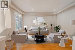 Living room with wood finished floors and recessed lighting - 