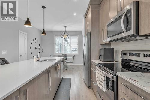 1713 Cornerstone Boulevard Ne, Calgary, AB - Indoor Photo Showing Kitchen With Double Sink With Upgraded Kitchen