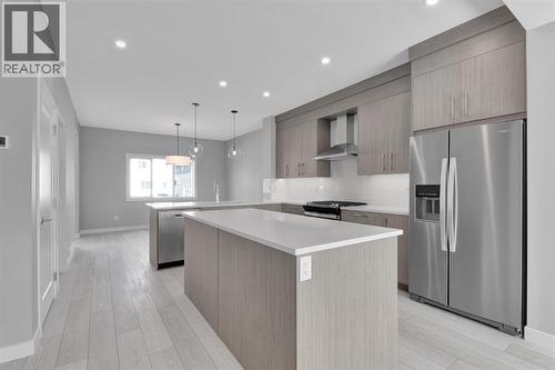 157 Dawson Wharf View, Chestermere, AB - Indoor Photo Showing Kitchen With Stainless Steel Kitchen With Upgraded Kitchen