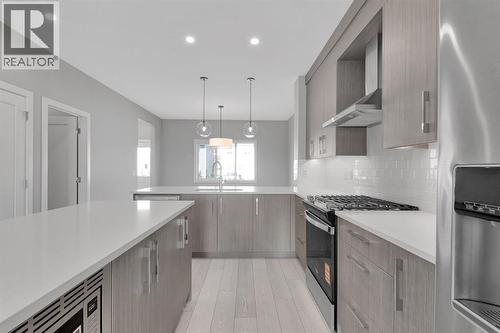 157 Dawson Wharf View, Chestermere, AB - Indoor Photo Showing Kitchen With Double Sink With Upgraded Kitchen