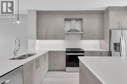 157 Dawson Wharf View, Chestermere, AB - Indoor Photo Showing Kitchen With Double Sink