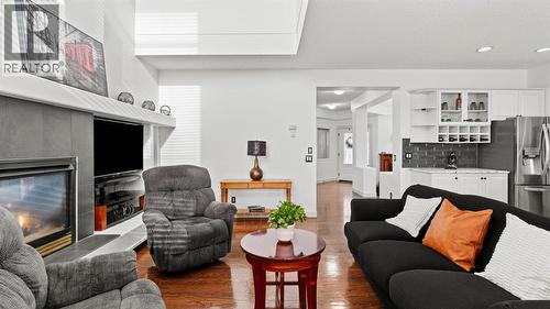 27 Cranwell Close Se, Calgary, AB - Indoor Photo Showing Living Room With Fireplace