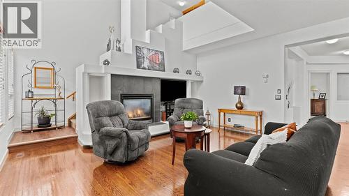 27 Cranwell Close Se, Calgary, AB - Indoor Photo Showing Living Room With Fireplace