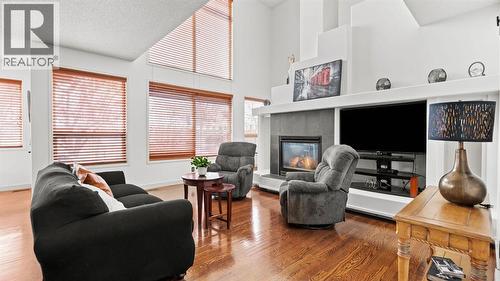 27 Cranwell Close Se, Calgary, AB - Indoor Photo Showing Living Room With Fireplace