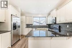 Huge kitchen with beautiful granite counter tops - 