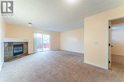 224 Highland Circle, Strathmore, AB - Indoor With Fireplace