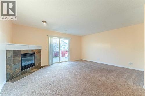 224 Highland Circle, Strathmore, AB - Indoor With Fireplace