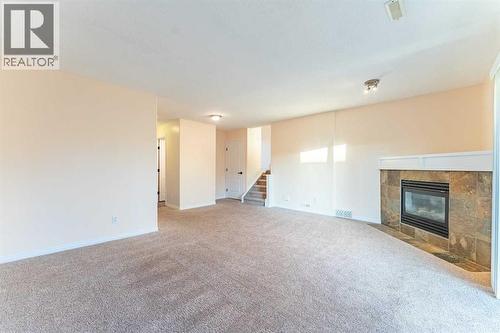224 Highland Circle, Strathmore, AB - Indoor With Fireplace