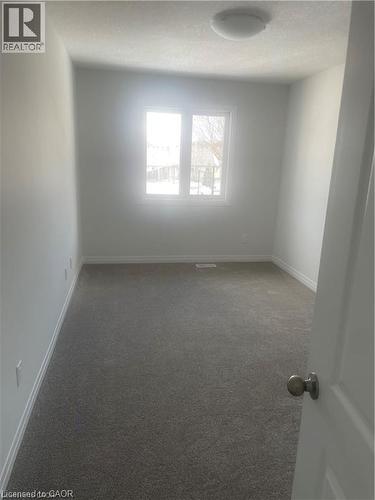 Spare room with light colored carpet - 152 Queensbrook Crescent, Cambridge, ON - Indoor Photo Showing Other Room