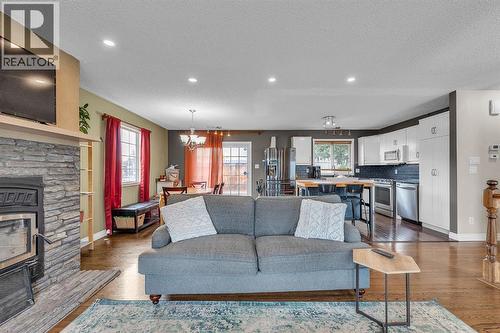 9883 Athens Road Se, Calgary, AB - Indoor Photo Showing Living Room With Fireplace