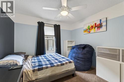 105 Riviera Crescent, Cochrane, AB - Indoor Photo Showing Bedroom