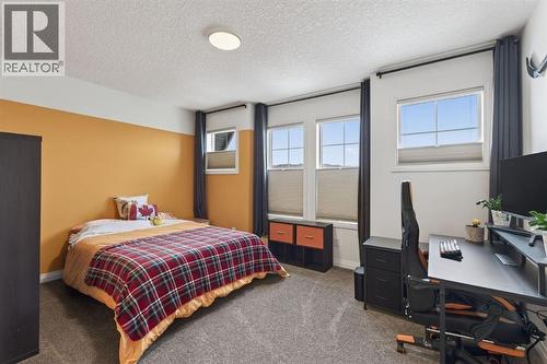 105 Riviera Crescent, Cochrane, AB - Indoor Photo Showing Bedroom