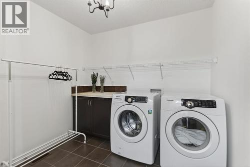 105 Riviera Crescent, Cochrane, AB - Indoor Photo Showing Laundry Room