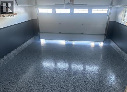 Epoxy Garage Floor - 105 Riviera Crescent, Cochrane, AB - Indoor Photo Showing Garage