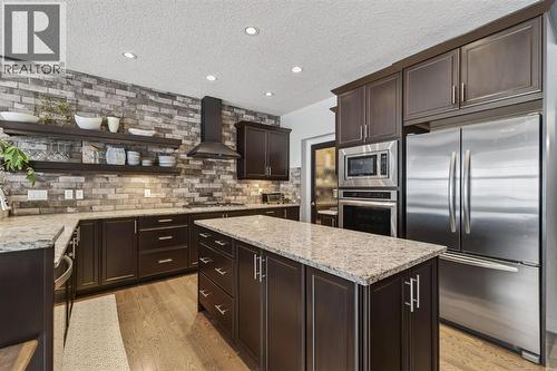 105 Riviera Crescent, Cochrane, AB - Indoor Photo Showing Kitchen With Stainless Steel Kitchen With Upgraded Kitchen