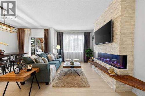 43 Chaparral Valley Common Se, Calgary, AB - Indoor Photo Showing Living Room With Fireplace