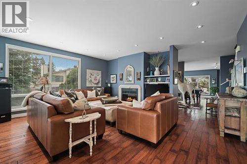 103 Stratton Park Sw, Calgary, AB - Indoor Photo Showing Living Room With Fireplace