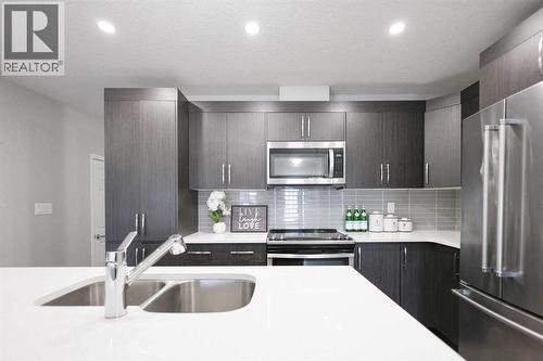 231 Windford Crescent Sw, Airdrie, AB - Indoor Photo Showing Kitchen With Stainless Steel Kitchen With Double Sink With Upgraded Kitchen