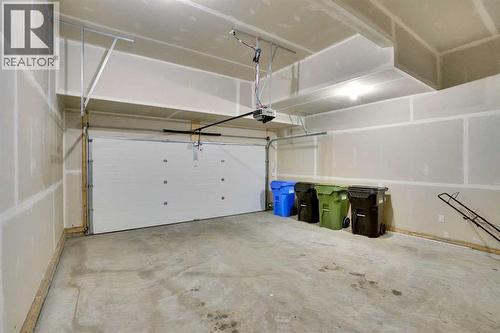 86 Edith Row Nw, Calgary, AB - Indoor Photo Showing Garage