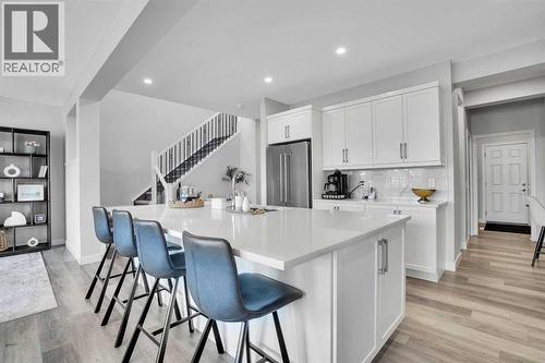 86 Edith Row Nw, Calgary, AB - Indoor Photo Showing Kitchen With Upgraded Kitchen