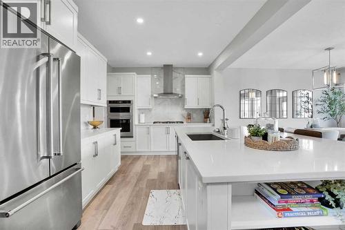 86 Edith Row Nw, Calgary, AB - Indoor Photo Showing Kitchen With Upgraded Kitchen