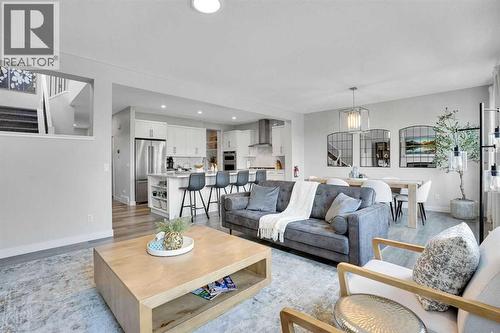 86 Edith Row Nw, Calgary, AB - Indoor Photo Showing Living Room