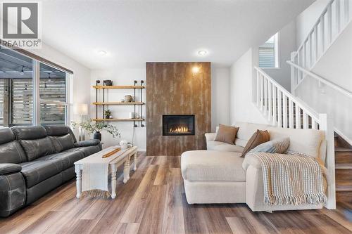 128 Auburn Bay Avenue Se, Calgary, AB - Indoor Photo Showing Living Room With Fireplace