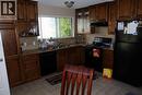 1908 Olympia Drive Se, Calgary, AB  - Indoor Photo Showing Kitchen With Double Sink 