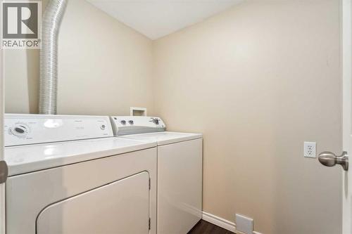 73 Rocky Ridge Heath Nw, Calgary, AB - Indoor Photo Showing Laundry Room