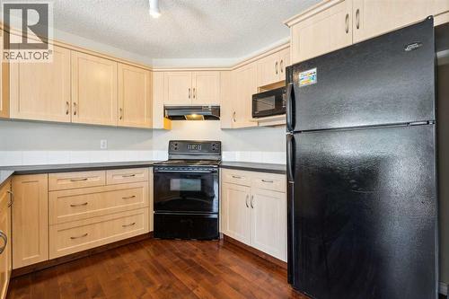 73 Rocky Ridge Heath Nw, Calgary, AB - Indoor Photo Showing Kitchen