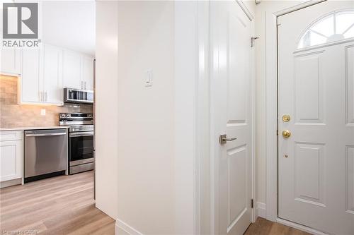 Foyer entrance featuring light wood-style floors - 27 Queenston Drive, Kitchener, ON - Indoor