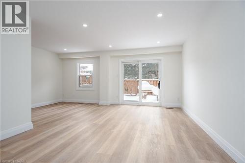 Unfurnished room featuring light wood-type flooring and recessed lighting - 27 Queenston Drive, Kitchener, ON - Indoor