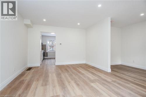 Unfurnished room featuring light wood-style flooring and recessed lighting - 27 Queenston Drive, Kitchener, ON - Indoor Photo Showing Other Room