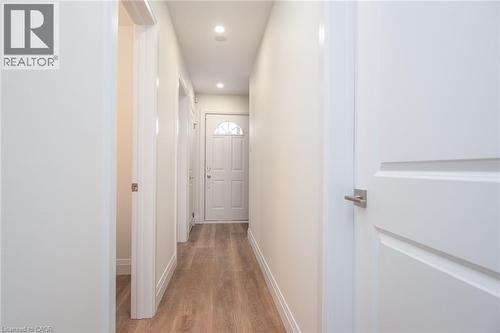 Corridor featuring light wood-style flooring and recessed lighting - 27 Queenston Drive, Kitchener, ON - Indoor Photo Showing Other Room