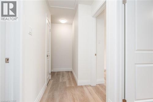 Hall featuring light wood finished floors and baseboards - 27 Queenston Drive, Kitchener, ON - Indoor Photo Showing Other Room