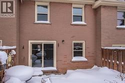 Snow covered house with brick siding - 