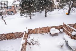 Snowy yard featuring a deck - 