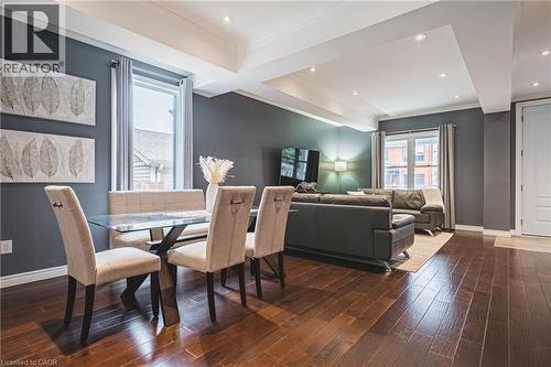 Dining area with dark wood-style floors, recessed lighting, and ornamental molding - 25 Orchard Hill, Hamilton, ON - Indoor Photo Showing Other Room