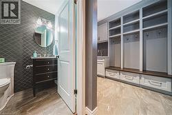 Mudroom with tile walls - 