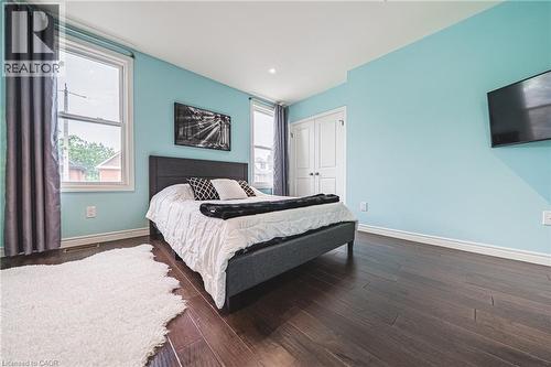 Bedroom featuring a closet and dark wood finished floors - 25 Orchard Hill, Hamilton, ON - Indoor Photo Showing Bedroom