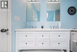 Bathroom with double vanity and toilet - 