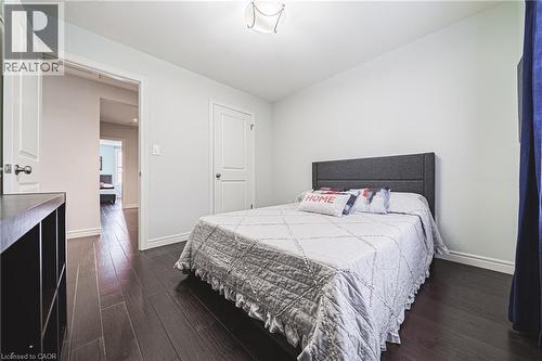 Bedroom featuring baseboards and dark wood-style flooring - 25 Orchard Hill, Hamilton, ON - Indoor Photo Showing Bedroom