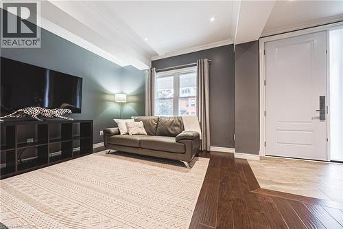 Living room with hardwood / wood-style floors and crown molding - 25 Orchard Hill, Hamilton, ON - Indoor Photo Showing Living Room