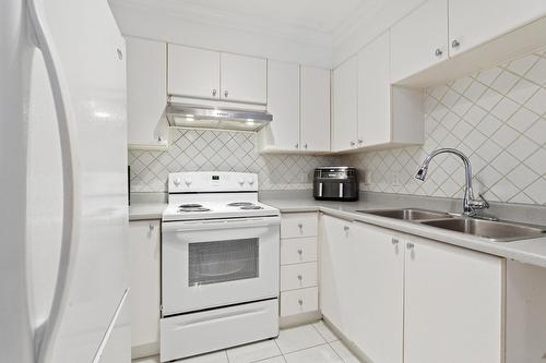Cuisine - 1-2408 Rue Des Grisons, Laval (Vimont), QC - Indoor Photo Showing Kitchen With Double Sink