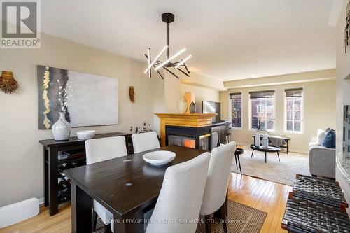 1584 Woodhenge Way, Mississauga, ON - Indoor Photo Showing Dining Room With Fireplace