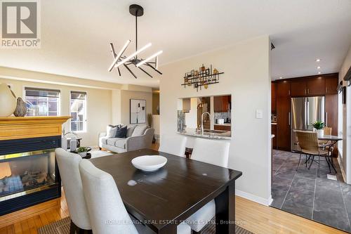 1584 Woodhenge Way, Mississauga, ON - Indoor Photo Showing Dining Room With Fireplace